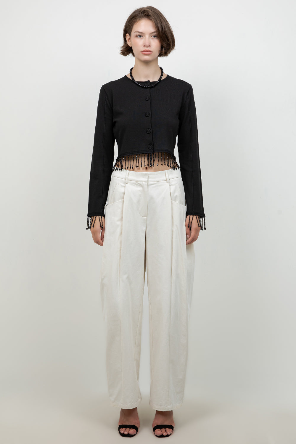 KNITTED BUTTON DOWN SWEATER WITH BEADED TASSELS