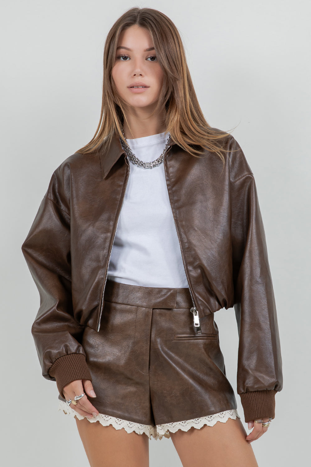FAUX LEATHER ZIP UP MOTO JACKET WITH MINI BUBBLE BOTTOM OPENING - DK BROWN - Whiteroom+Cactus