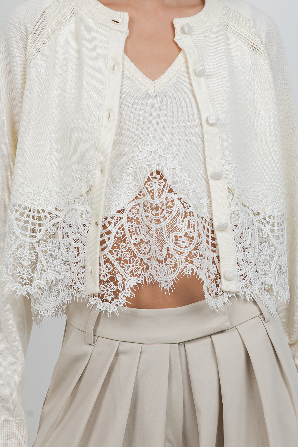 KNITTED SWEATER WITH LACE EDGE DETAILING