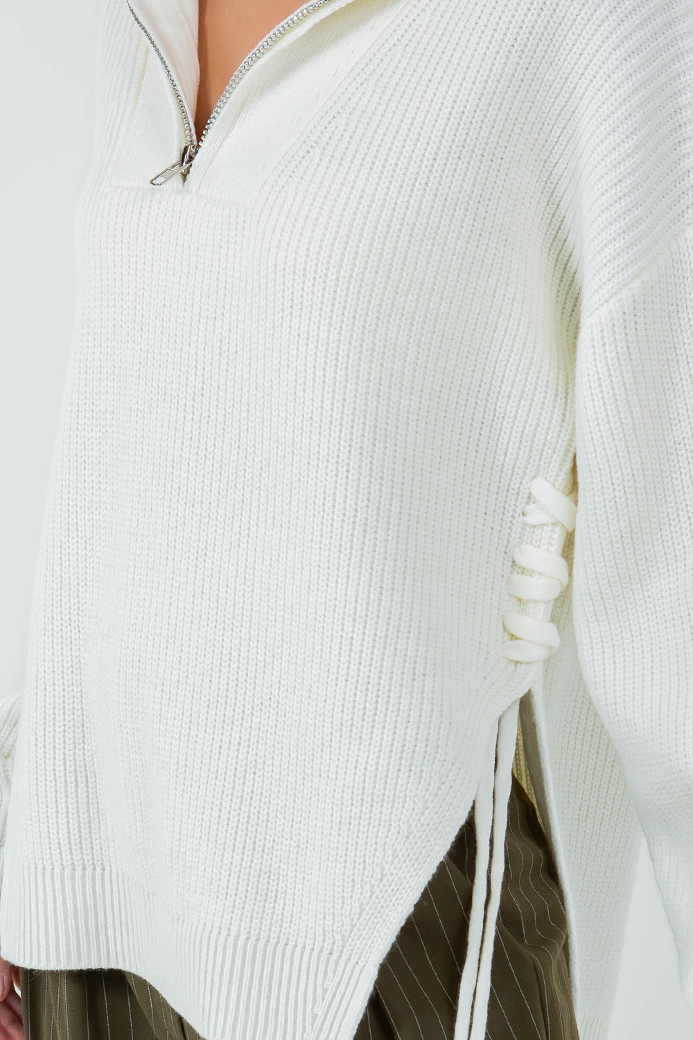 ZIP UP KNIT TOP WITH TIE SIDE DRAWSTRING DETAIL - IVORY