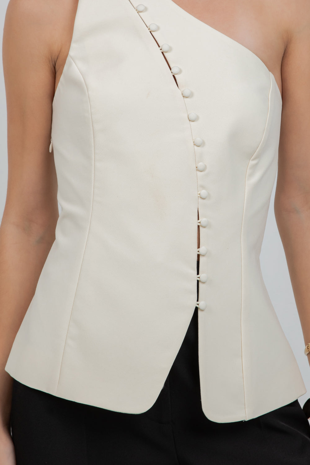 STRUCTURED WOVEN ASYMMETRICAL SLEEVELESS TOP WITH BUTTON ACCENT
