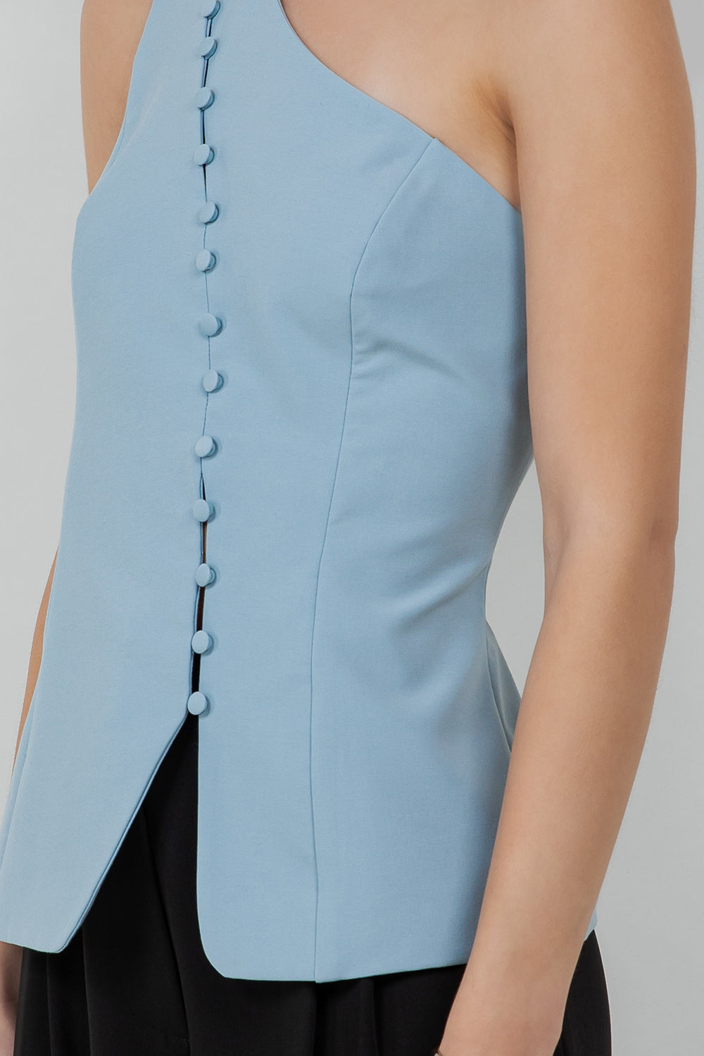 STRUCTURED WOVEN ASYMMETRICAL SLEEVELESS TOP WITH BUTTON ACCENT