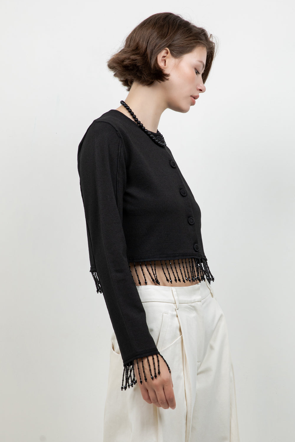 KNITTED BUTTON DOWN SWEATER WITH BEADED TASSELS
