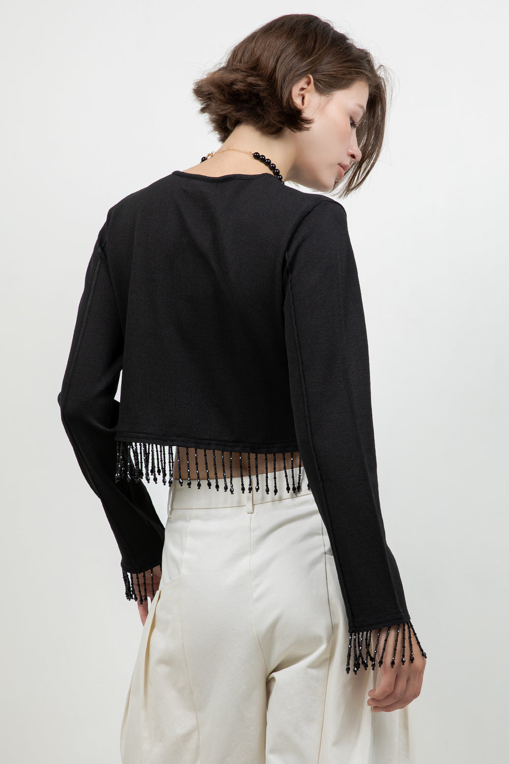 KNITTED BUTTON DOWN SWEATER WITH BEADED TASSELS